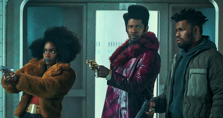 They Cloned Tyrone - (L to R) Teyonah Parris as Yo-Yo, Jamie Foxx (Producer) as Slick Charles and John Boyega as Fontaine in They Cloned Tyrone. Cr. Parrish Lewis/Netflix © 2023.