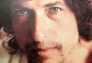bob dylan dedica música a Woody Guthrie